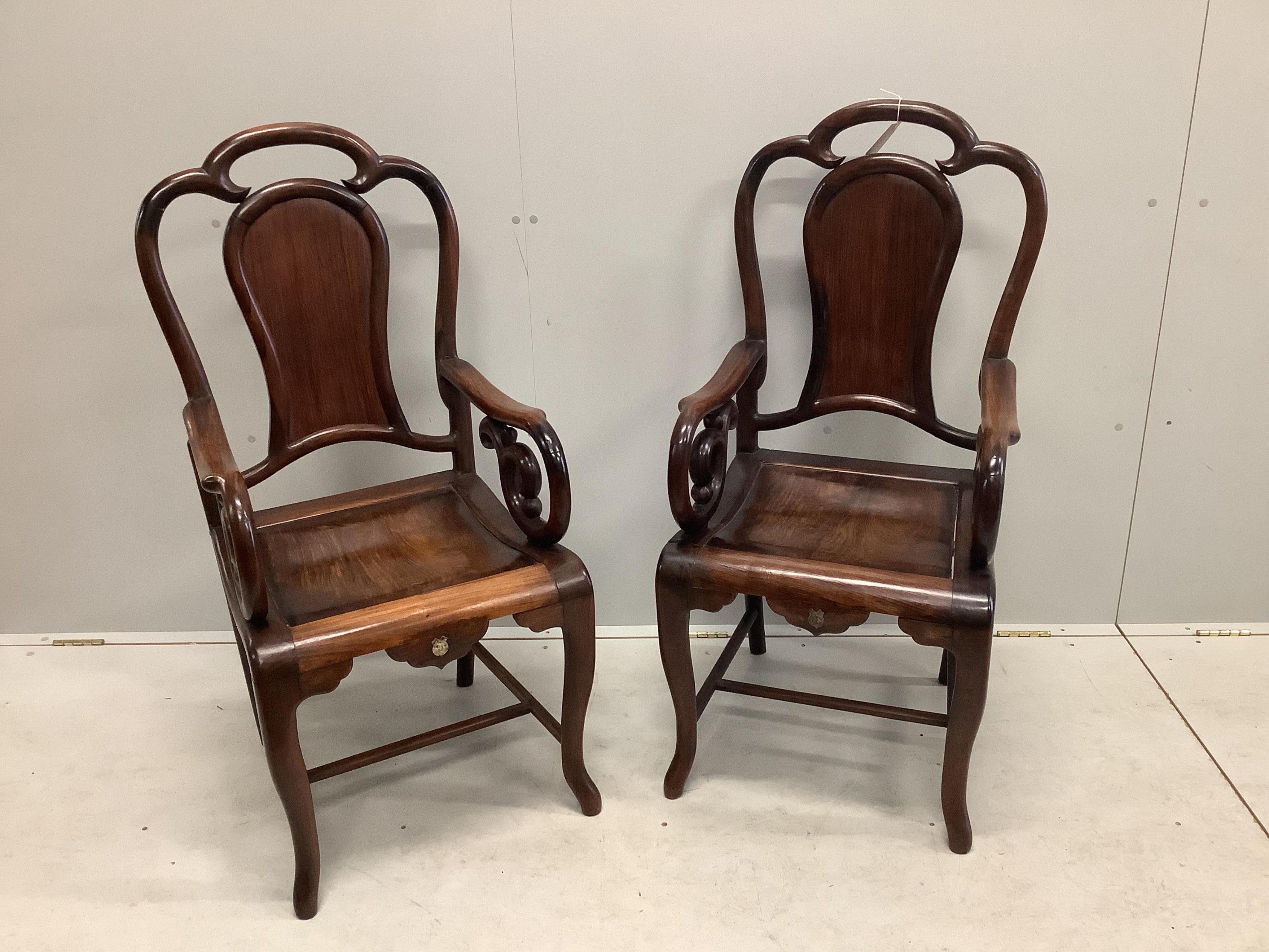 A pair of Chinese hongmu elbow chairs exhibited at British Empire Exhibition Wembley 1924, width 52cm, depth 48cm, height 110cm. Condition - fair to good